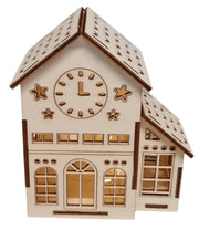 A wooden Christmas model of a house featuring a clock, showcasing intricate craftsmanship and design details.