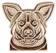 A wooden sculpture depicting the head of a Collie dog, showcasing intricate craftsmanship and natural wood textures.