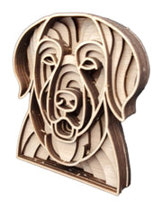 A wooden cutout of a Labrador dog's head, showcasing intricate craftsmanship and natural wood grain details.